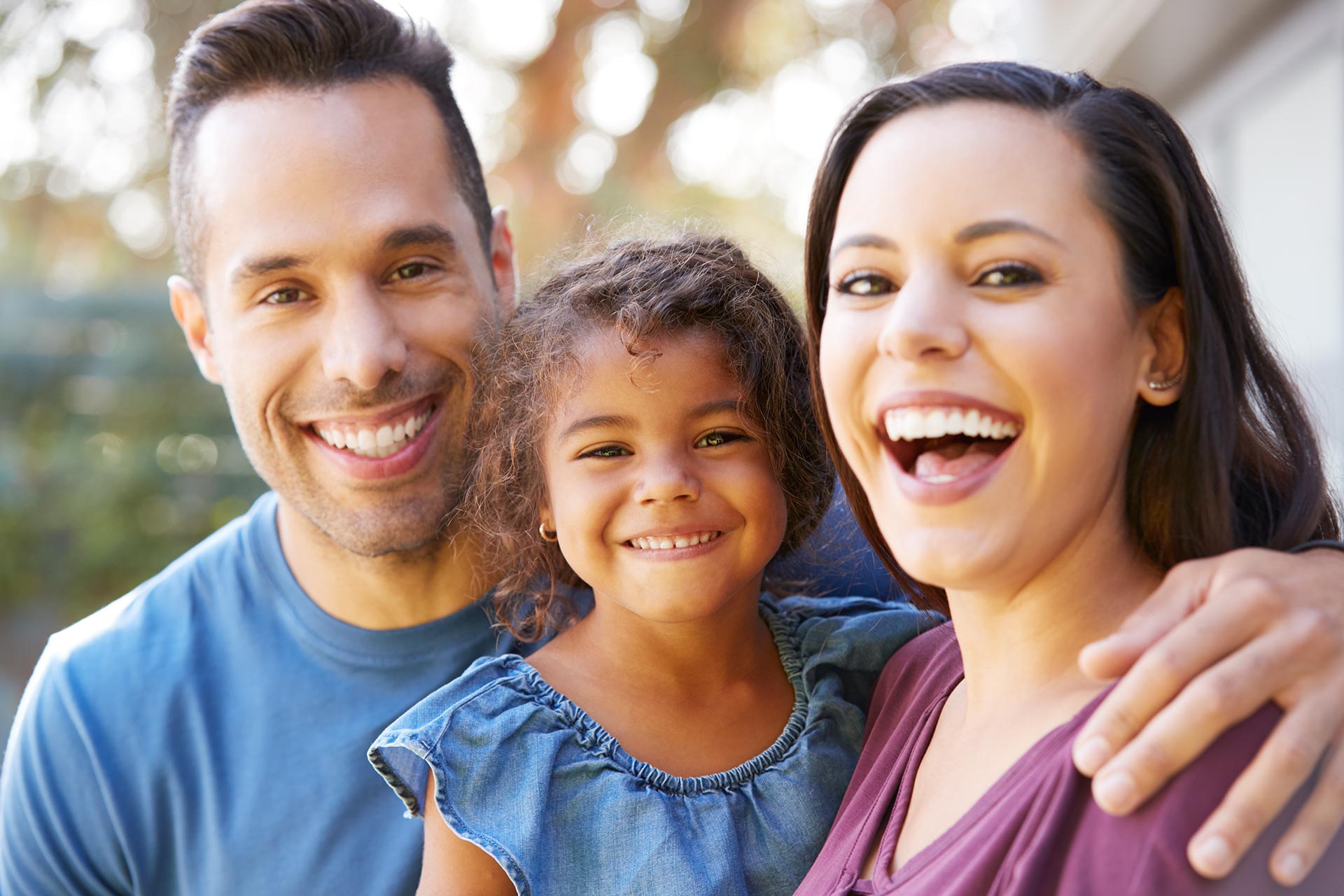 portrait of smiling hispanic family with daughter Y68JEWE