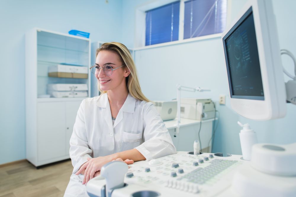 portrait-of-young-female-dentist-in-office-PT6GDWC