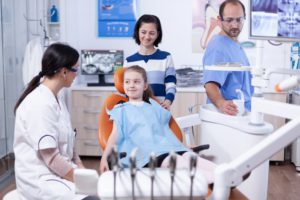 happy little girl at pediatric dentist wearing den 2021 08 30 09 36 39 utc 1