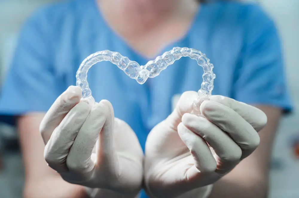 female doctor holding two transparent heart shaped 2022 01 11 16 27 00 utc 1