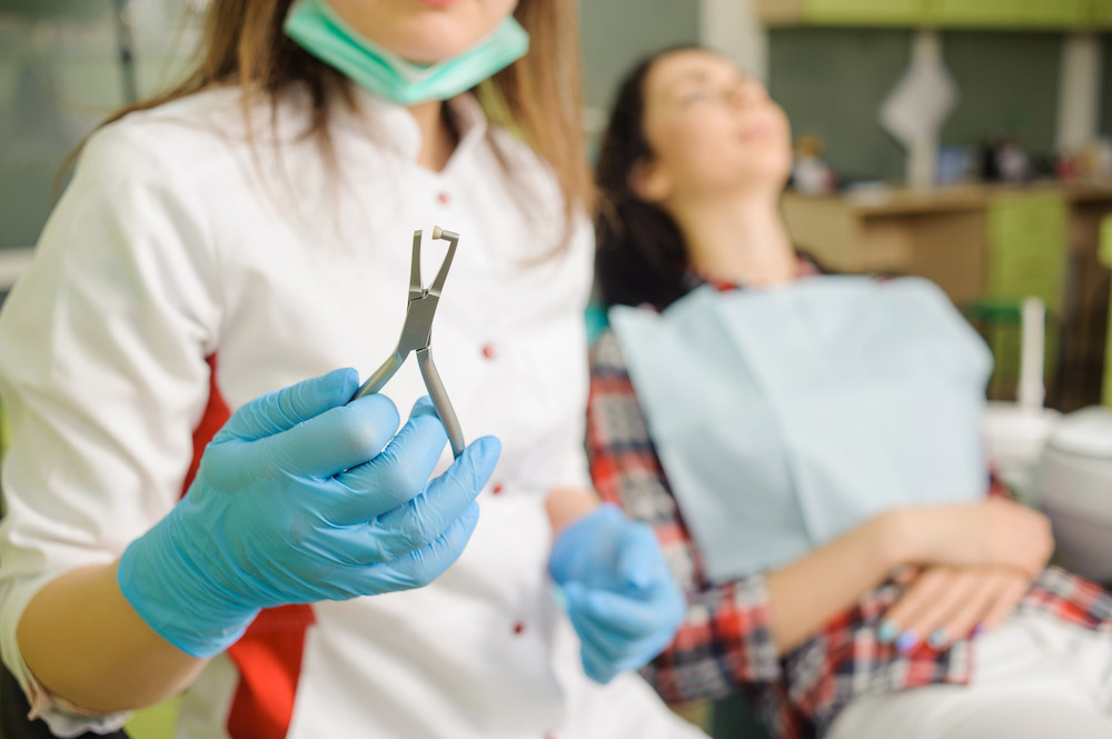 Female Dentist Holding Dental Tool Orthodontic Tr Utc