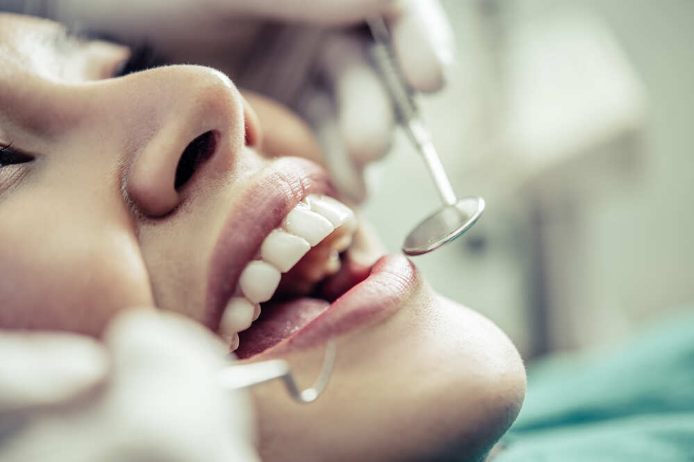 dentists treat patients teeth 2021 08 31 08 33 43 utc 1 1